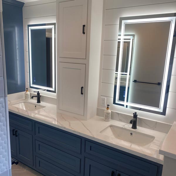 renovated bathroom vanity with light up mirrors